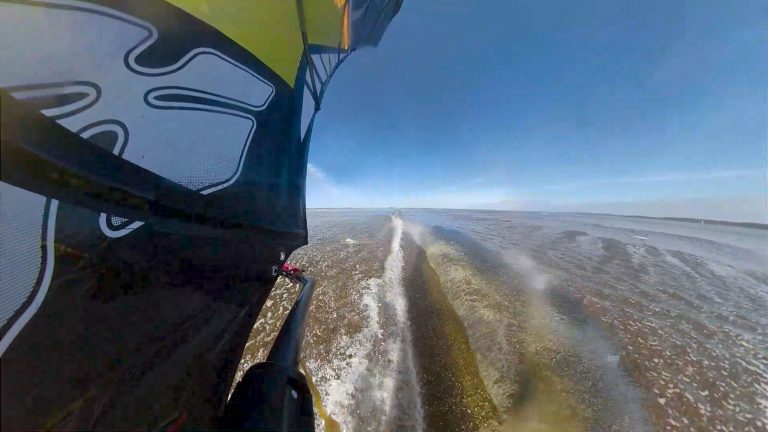 Blasting across the glassy flat water
